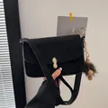 Matte black crossbody bag with golden peanut buckle and fuzzy charm for women - Square Bag with Monster Pendant / Black