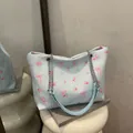 Light blue bubble texture tote bag with pink bow prints and silver chain strap - No Pendant / Blue