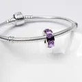 Silver snake chain bracelet featuring a charm with radiant purple square zircons - Purple