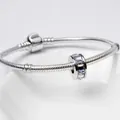 Silver snake chain bracelet featuring a cylindrical charm with colorful square zircon stones - AB Color