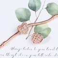 Roségouden armband met fonkelende hartvormige hangers en pavé-zetting op slangenketting - Roségoud