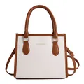 Bolso de mano bicolor blanco y marrón con bandolera ajustable y detalles dorados - Blanco
