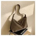 Detail of brown suede tote bag featuring adjustable silver buckle and soft pleated texture - Brown