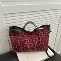 Red leopard and rose print tote bag with brown leather handles and adjustable strap - Red