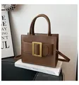 Dark brown structured leather tote bag with large matte gold buckle and top handle - Brown