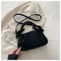 Black pleated tote bag in matte suede finish with adjustable strap and silver hardware - Black
