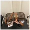 Close-up of vintage brown geometric print handbag with gold buckle and leather strap - Style 1 Coffee