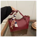 Burgundy faux leather tote bag with elegant silk scarf handle and adjustable strap - Red