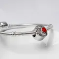 Silver snake chain bracelet featuring a round charm with red enamel hearts and CZ stones - Four-leaf Clover Big Hole Bead / Red
