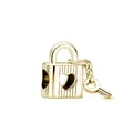 Macro view of gold heart padlock and key pendant with elegant vertical grooves - Heart Cutout Striped Padlock With Key / Gold