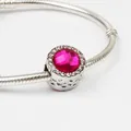 Silver snake chain bracelet with magenta faceted crystal charm and heart cutout details - Rose Red