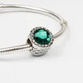 Green faceted crystal charm bead with zircon halo on silver snake chain bracelet - Green