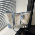 Chic beige and blue tote bag with graffiti print and fluffy cloud charm accessory - With Cloud Pendant / Blue