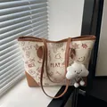 Chic beige canvas tote bag with brown graffiti print and cute cloud charm accessory - With Cloud Pendant / Brown
