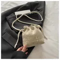 Beige woven bucket bag with pink and green floral embroidery and cotton rope strap - Khaki
