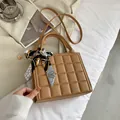 Brown quilted crossbody bag with silk scarf handle and geometric embossed pattern - Khaki