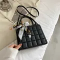 Black quilted checkered handbag with a light blue decorative scarf and long strap - Black