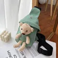 Light green canvas crossbody bag featuring a cute plush teddy bear decoration - Green