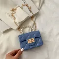 Mini blue quilted handbag with white pearl handle and gold chain strap for women - Blue