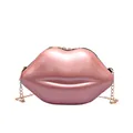Pink pearlescent lip-shaped mini crossbody bag with gold chain strap on white background - Pink