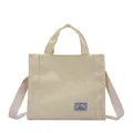 Minimalist beige canvas tote bag with top handles and shoulder strap for daily casual use - Off White