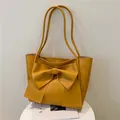 Bolso tote amarillo mostaza minimalista con lazo decorativo grande y correas largas - Marrón Amarillento