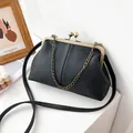 Classic black frame bag with litchi grain leather and bronze metal clasp - Black