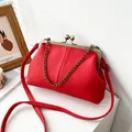 Red lychee pattern shell bag with bronze metal clasp and chain strap for women - Red