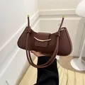Minimalist dark brown half-moon underarm bag with gold metal buckle and knotted strap - Dark Brown