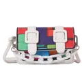 Detail of colorful geometric print crossbody bag with white chain and buckle accents - White