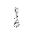 Macro shot of vintage silver dragon charm bead for DIY necklaces and bracelets - Dragon