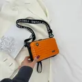 Mini orange suitcase crossbody bag with Forever Young wide strap and hardshell finish - Orange