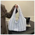 Detail of light blue and white striped puffy tote bag with soft 3D bubble fabric texture - Blue and White Stripes