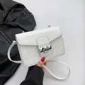 White crossbody bag with embossed heart texture and stylish silver ring hardware - White