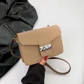 Khaki shoulder bag with embossed wavy texture and silver metal ring buckle closure - Khaki