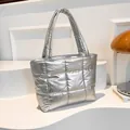 Quilted silver tote bag in glossy metallic finish with padded square stitching texture - Silver