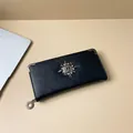Portefeuille long noir en cuir avec emblème tête de mort et rivets métalliques - Style Rivet de Tête de Mort / Noir