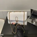 Modern white leather square bag with gold oval buckle and elegant chain strap - White