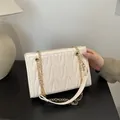 Chic creamy white underarm bag with V-quilted pattern and golden chain strap - White