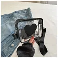 Detail of transparent PVC crossbody bag with black heart pattern and adjustable strap - Black