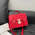 Classic red leather satchel with golden buckle hardware and top handle strap - Red