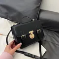 Classic black vintage messenger bag with gold lock and adjustable shoulder strap - Black