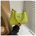 Detail of lime green mini trapezoid handbag with silver star and knot handle - Green