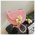 Detail of pink woven cotton crossbody bag featuring a 3D sunflower and braided rope strap - Pink