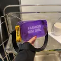 Purple transparent jelly crossbody bag with yellow strap and Fashion Mini Girl text - Purple