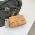 Beige quilted shoulder bag with silver butterfly buckle and metal chain strap - Khaki