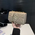 Khaki quilted crossbody bag with gold letter lock, tassel, and metal chain strap - Khaki