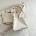Minimalist cream white bucket bag with drawstring detail and dual slender shoulder straps - White