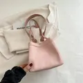 Minimalist pink fabric drawstring bucket bag with soft shoulder strap in creamy pink - Pink