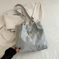 Silver shoulder tote bag with crinkled texture and metallic butterfly detail - Silver